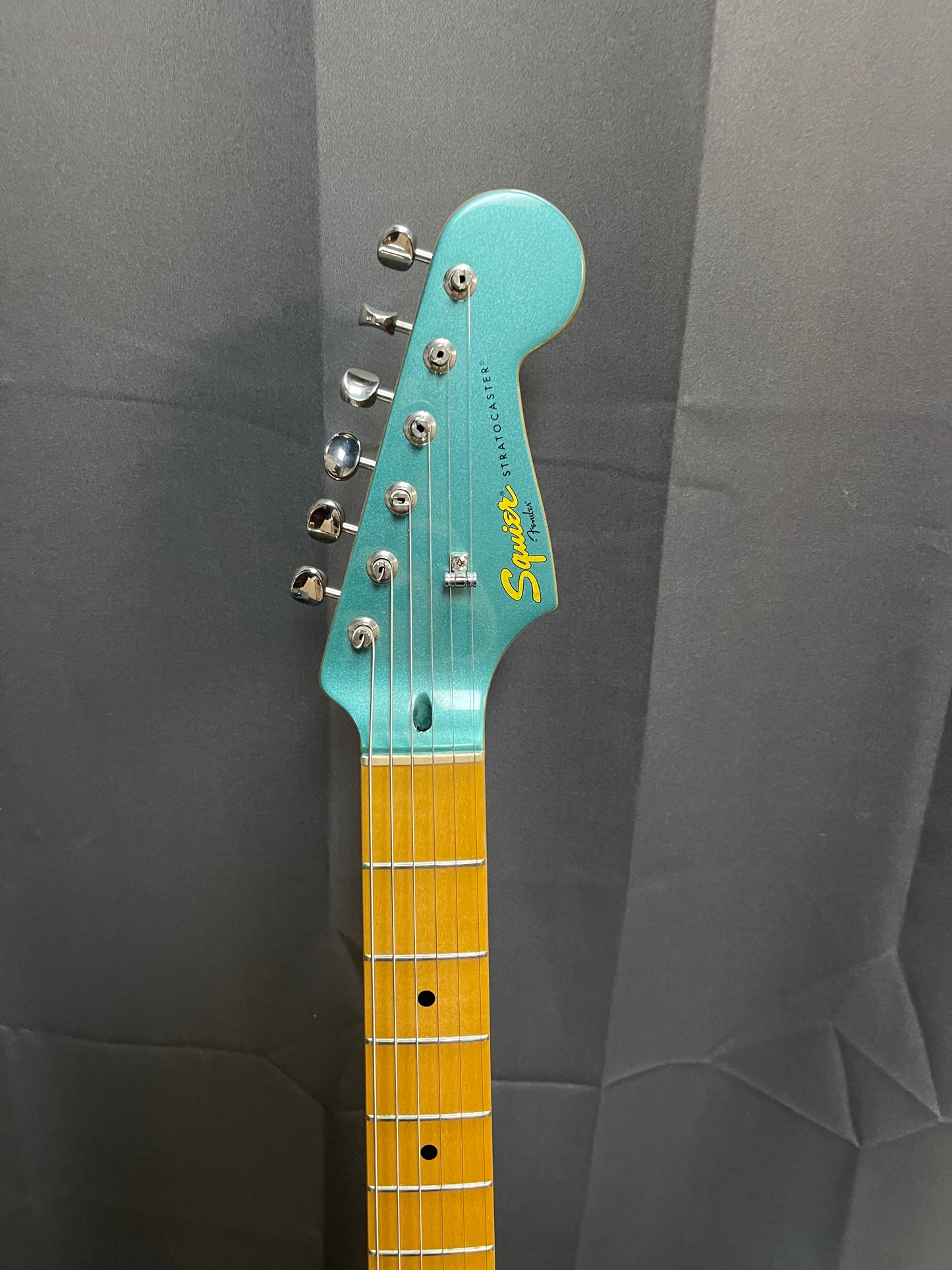 FENDER SQUIER TEAL GREEN STRAT W/ DELUXE BRIDGE AND GIG BAG